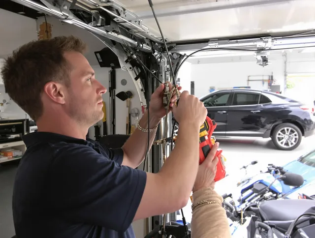 Torrance Garage Door Repair safety certified technician performing cable replacement in Torrance